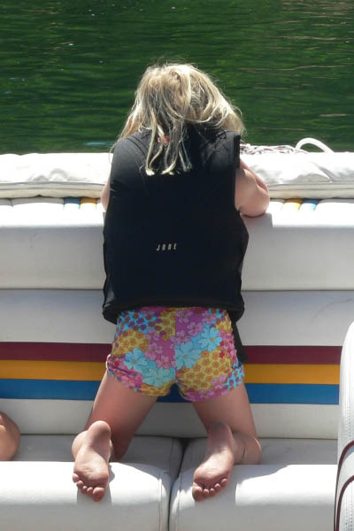 Katherine watches out the back of Rich's boat.