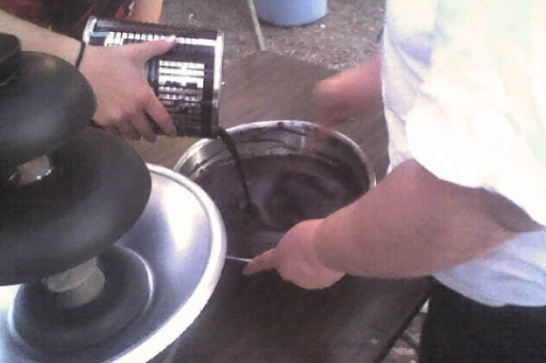 Mixing up chocolate for the chocolate fountain.  Yum!