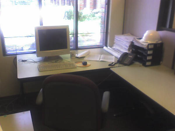 Greg Potemkin's cube again.  He has a keyboard, mouse, monitor -- but no PC ...