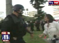 LAPD cop shoving around Fox journalist